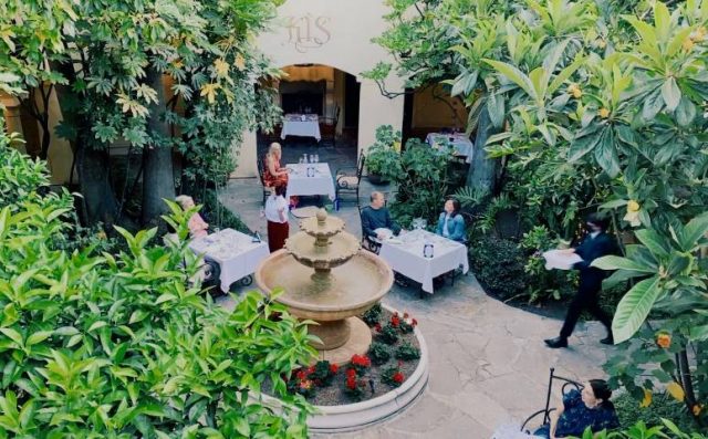 people dining in a courtyard