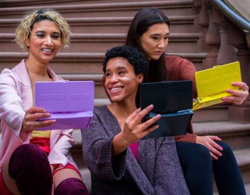 5 Beauty Tips And Tricks From Travel Bloggers girls checking out their makeup in a travel mirror