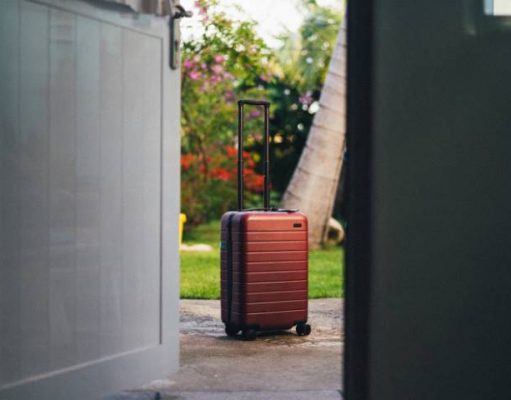 Keep your luggage safe while travelling: Choose storage service provider lugage sitting at a doorway