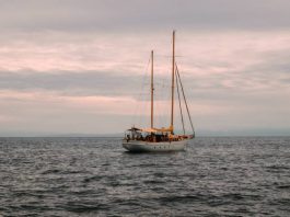 classic wooden sailboat sailing in the Atlantic Ocean