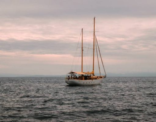 A Beginners Guide to Buying & Repairing an Old Boat classic wooden sailboat sailing in the Atlantic Ocean