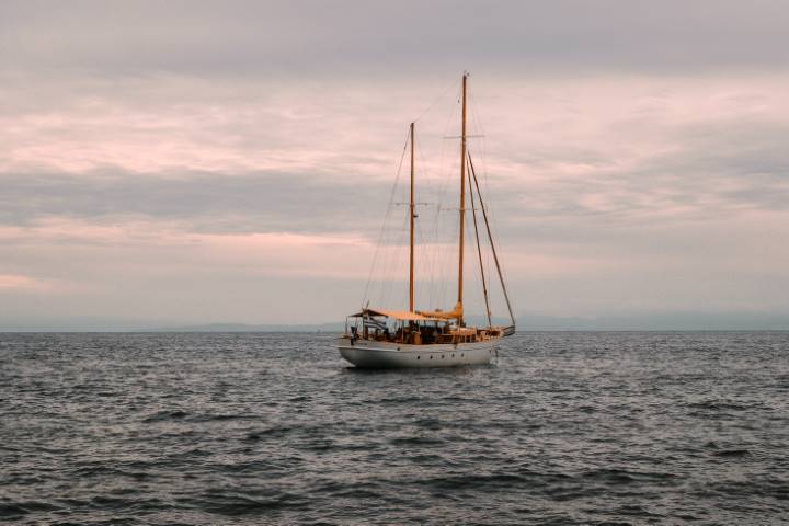 classic wooden sailboat sailing in the Atlantic Ocean