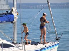 Why Traveling By Boat With Kids Is Much Better Than Staying In A Hotel family on a sailboat