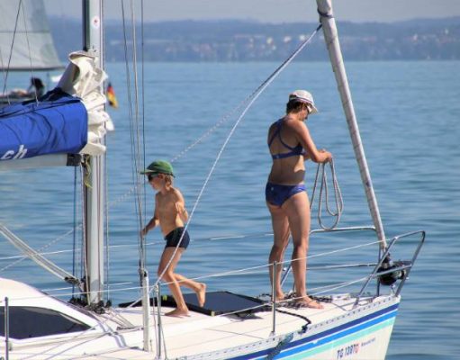 Why Traveling By Boat With Kids Is Much Better Than Staying In A Hotel family on a sailboat