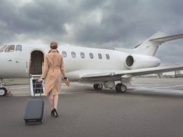 woman getting on a private jet