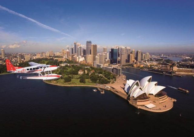 A Sydney Seaplane flying over Sydney harbour