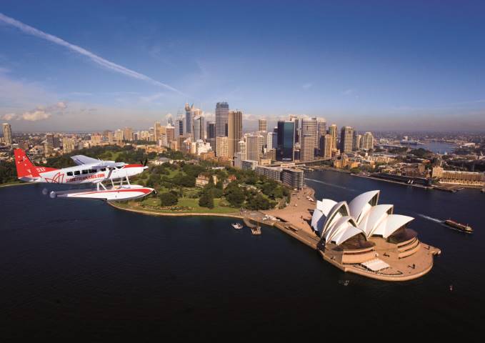 A Sydney Seaplane flying over Sydney harbour