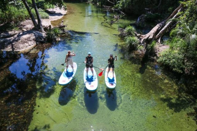 paddle boarding on a calm river