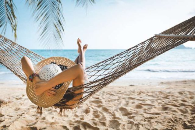 girl in a hammok on the beach