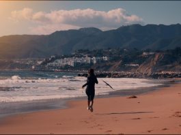 girl running on a beach in LA