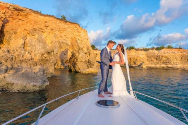 bride and growm getting married on a boat in the caribbean
