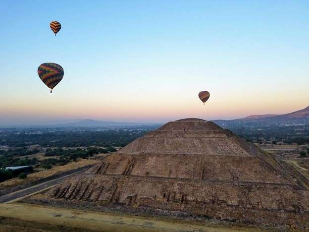 hot air ballooning over aztec ruins