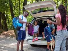 How to Prep for a Road Trip With the Kids family getting ready for a hike