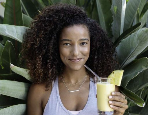 Four Seasons Hotel Westlake Village Announces the Opening of the Center for Health & Wellbeing girl holding wellness smoothie