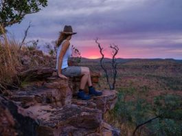girl sitting on a cliff in Kimberly Australia