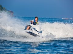 Jet Ski Vs Waverunner: Which One is Right for You? man on a jet ski