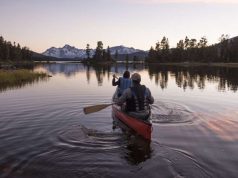 Explore Indigenous-owned Resorts and Experiences in BC canoing at an Indigenous-owned Resorts in BC