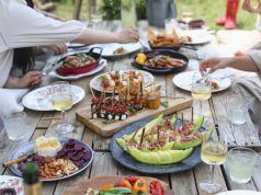 Planning the perfect neighborhood picnic: Tips and tricks to keep in mind picnic table full of food