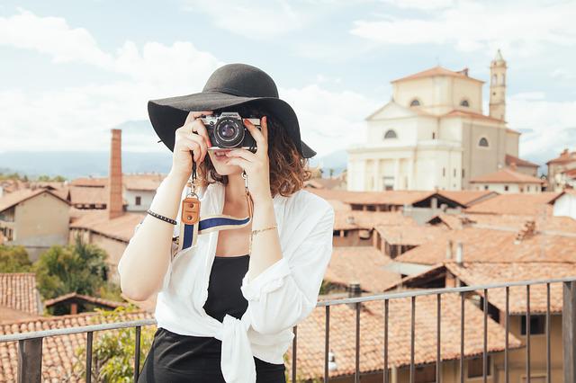 girl traveling with camera taking photo