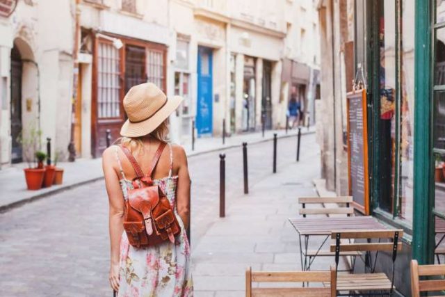 Woman Tourist Walking On The Street