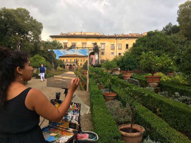 woman painting in Tuscany