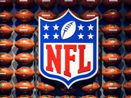 NFL logo on a wall of footballs