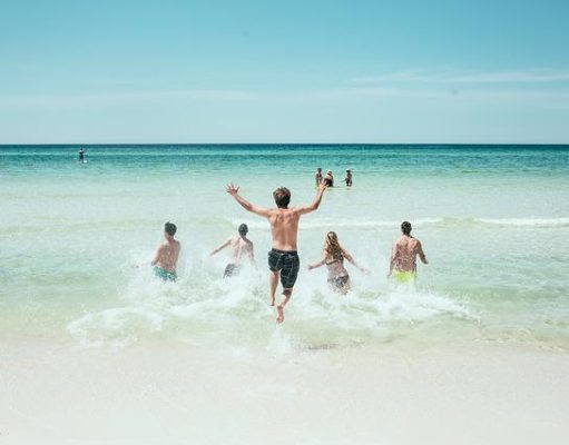 The Perfect Weekend Itinerary For Your Vacation Destination people running on a beach