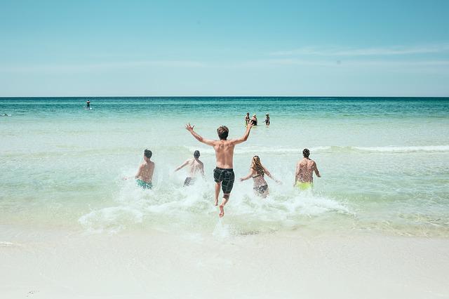 people running on a beach