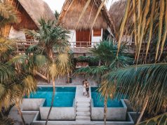 Once-In-A-Lifetime Honeymoon Destinations That Are Worth the Money couple on their honeymoon tropical destination