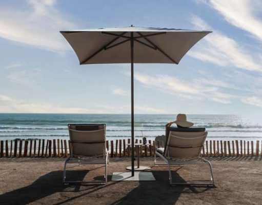 Luxury Hotels with Some Of The Best Beaches Person sitting on beach