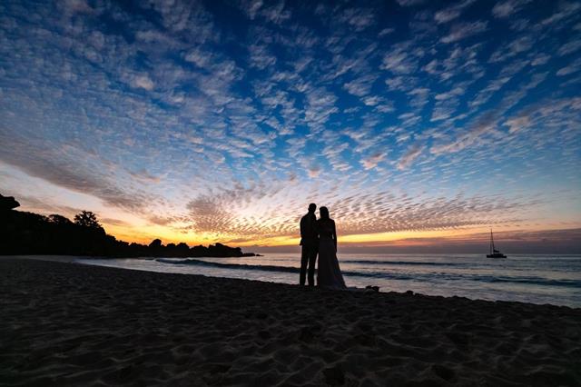 Couple on beach at night 