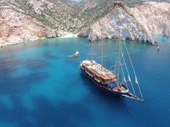 Eight Reasons to Visit Greece this Fall Large sailboat in bay