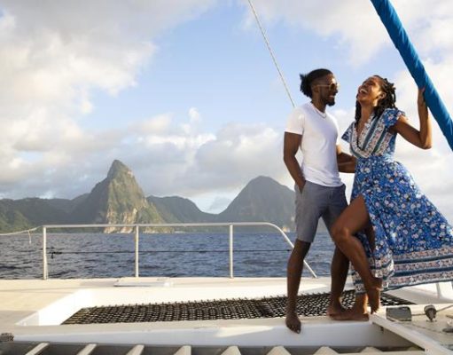 Celebrate Creole Heritage Month at Windjammer Landing Couple standing on deck of boat on ocean