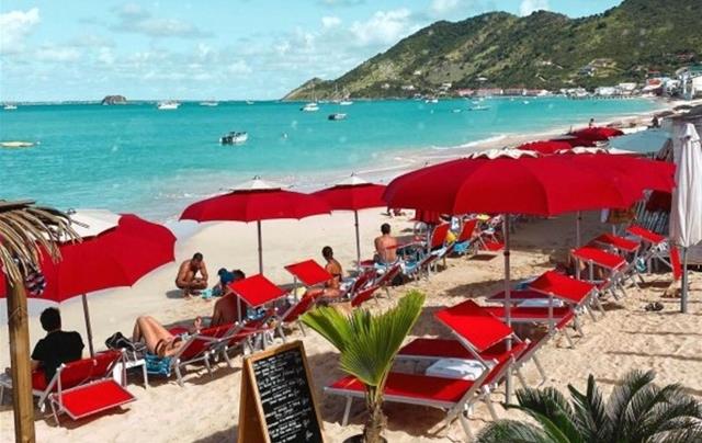 People on beach at resort in St. Martin