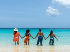 Charming Villas for a Memorable Bachelorette Getaway in Anguilla 4 people holding hands in the ocean beach