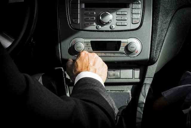 Man in Black Suit Inside Car