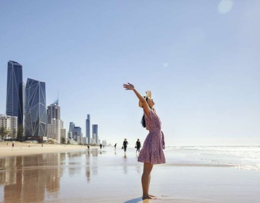 New Direct Flight Takes Off From San Francisco To Brisbane With United Airlines Today Lady enjoying the beach in Brisbane