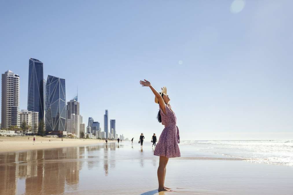 Lady enjoying the beach in Brisbane