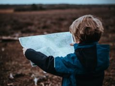 Traveling with Toddlers: Tips to Make Your Trip Go Smoothly child looking at a map