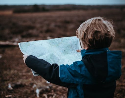 Traveling with Toddlers: Tips to Make Your Trip Go Smoothly child looking at a map