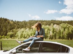 How Dangerous Is Car Travel? 6 Tips For More Safety When Driving girl sitting on the top of a car