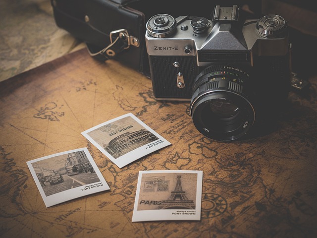 travel photos and camera on a table