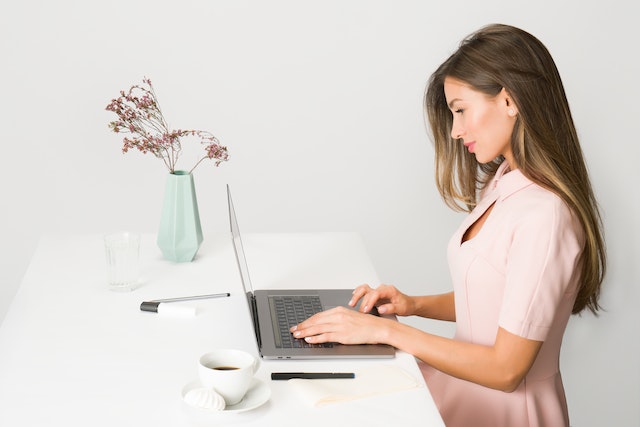 girl working on a laptop at a desk