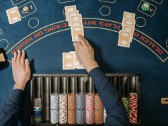 6 Fun and Inexpensive Holiday Ideas for Casino Lovers  Dealer Holding Playing Cards