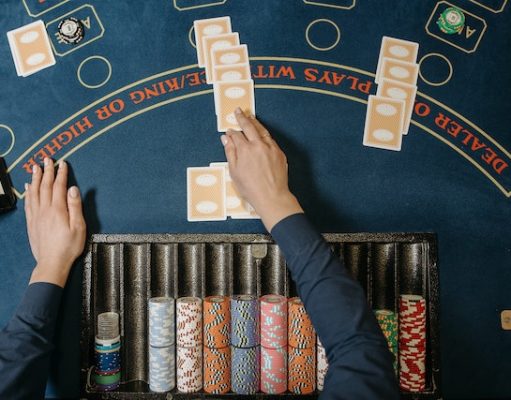 6 Fun and Inexpensive Holiday Ideas for Casino Lovers Dealer Holding Playing Cards