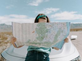 girl traveling looking at map