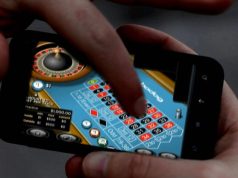 What should Canadians keep in mind when using an online casino while traveling abroad?