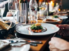 Savory Sojourns: A Culinary Adventure Through America Gourmet meal and white wine