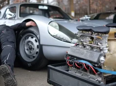 Roaming Roads and Revving Engines: The Ultimate Guide to Traveling with Your Car mechanic behind a selectively focused engine