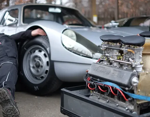 Roaming Roads and Revving Engines: The Ultimate Guide to Traveling with Your Car mechanic behind a selectively focused engine